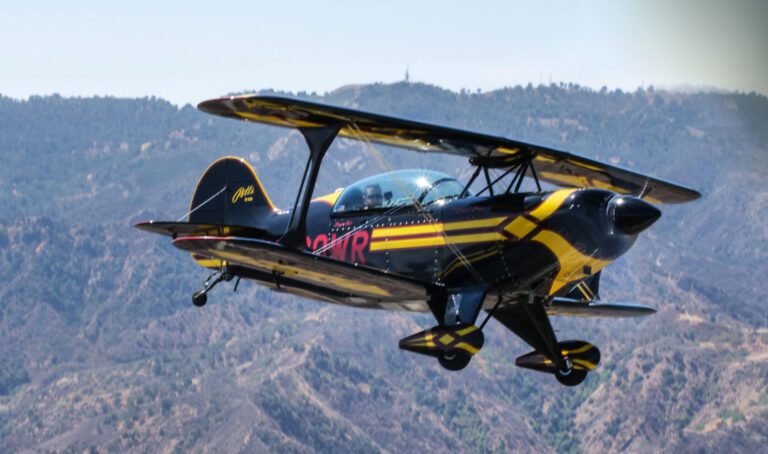 Pitts Bi-Plane flown by Chief Instructor Moe Tarakji buzzes through the hills outside of Los Angeles.