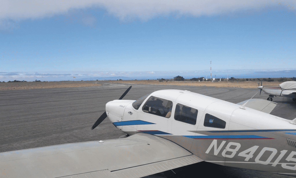 Piper Archer sits with other flight school aircraft overlooking the Van Nuys runway.