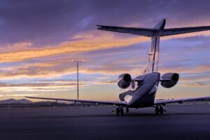 corporate aircraft sits at sunset on the tarmac in the Greater Los Angeles Area