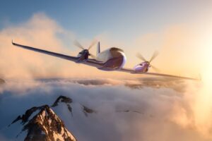 Twin Engine Airplane Flying over the Rocky Mountain Landscape